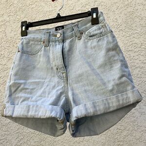 Light colored tight high waisted jean shorts